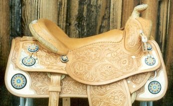 A Western Saddle decorated with Native American Bead Work to